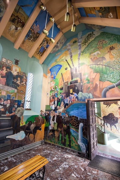 Mural by Randall Davey depicting Julie and Spencer Penrose among regional history